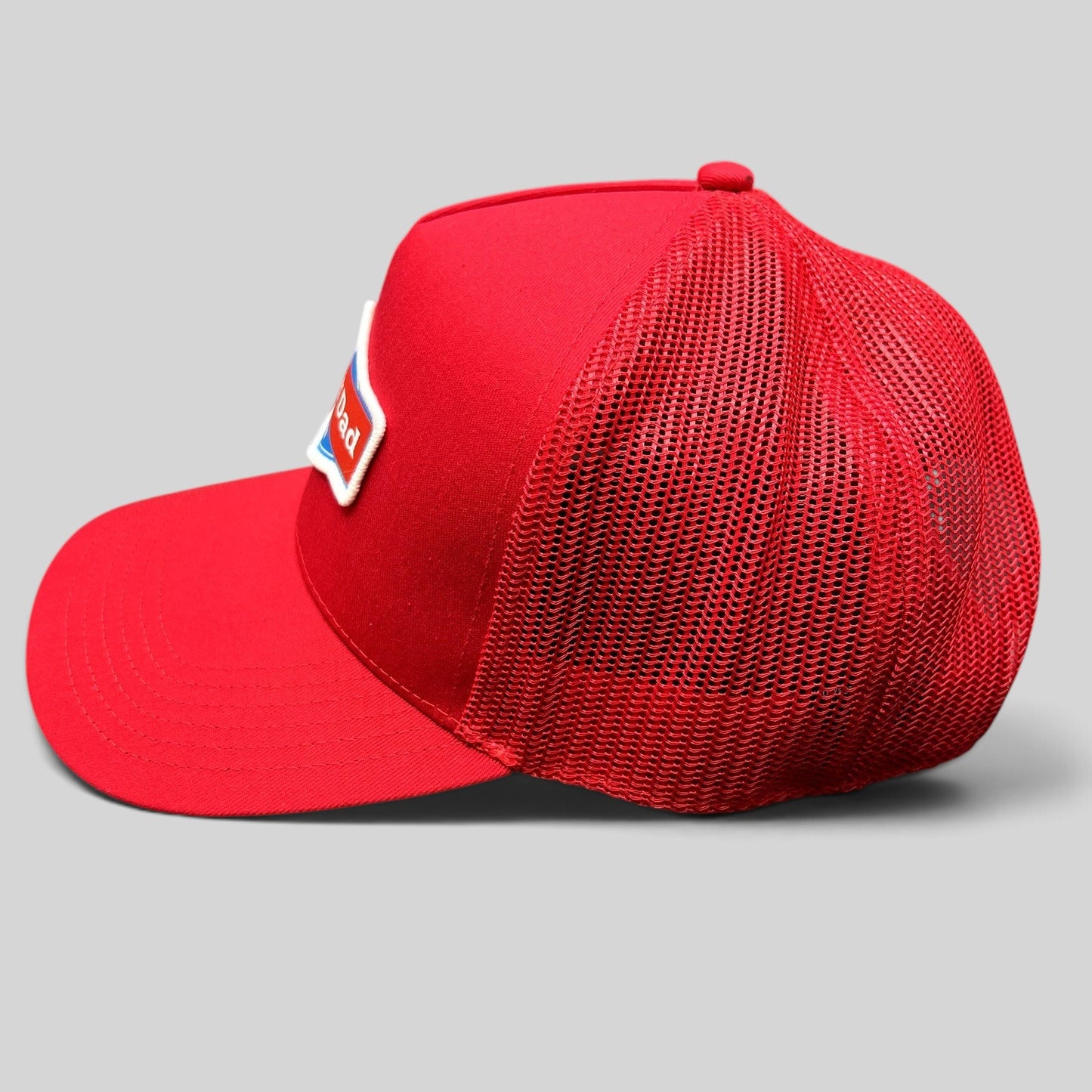 Raree Finds Happy Dad Hard Seltzer red trucker snapback hat with mesh back and embroidered logo patch side view
