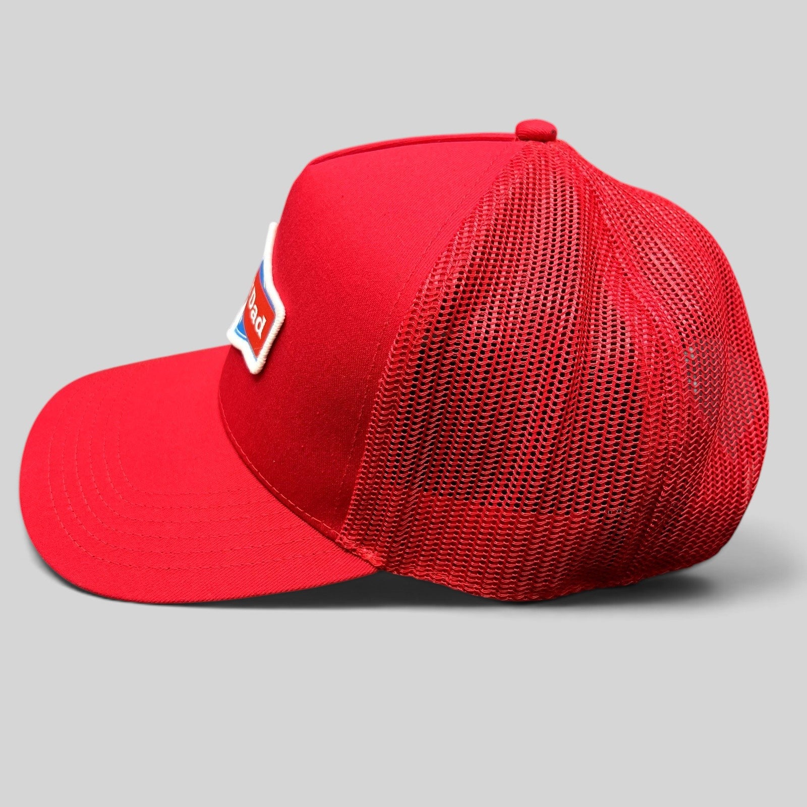 Raree Finds Happy Dad Hard Seltzer red trucker snapback hat with mesh back and embroidered logo patch side view