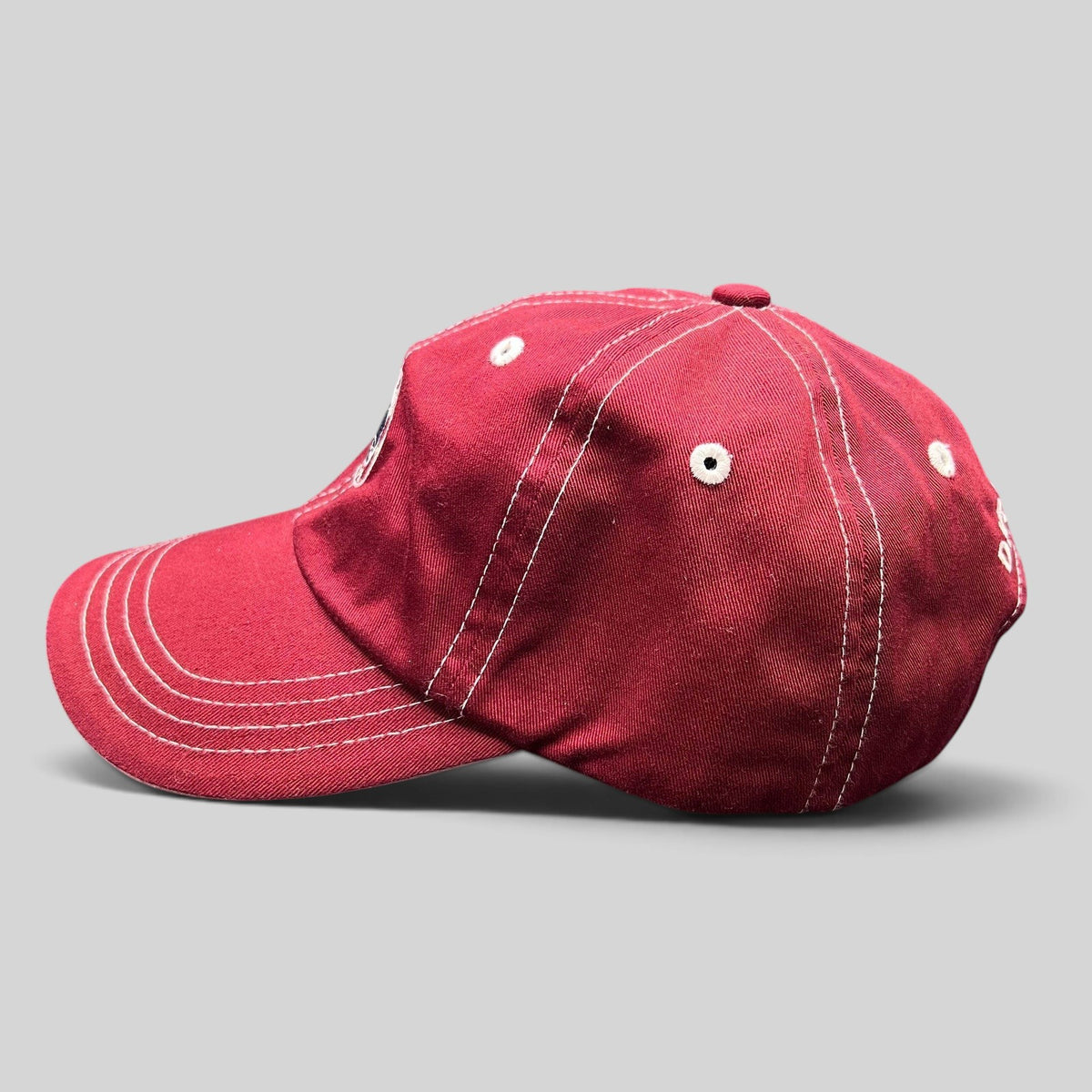 Raree Finds red Imperial strapback hat with white contrast stitching and Snowmass Club logo, side profile view.