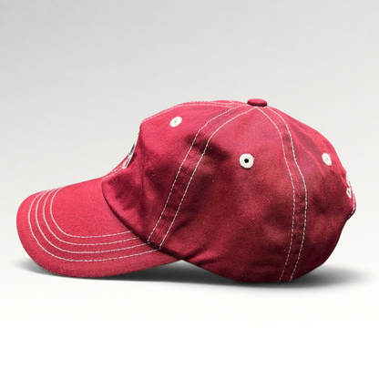 Raree Finds red Imperial strapback hat with white contrast stitching and Snowmass Club logo, side profile view.