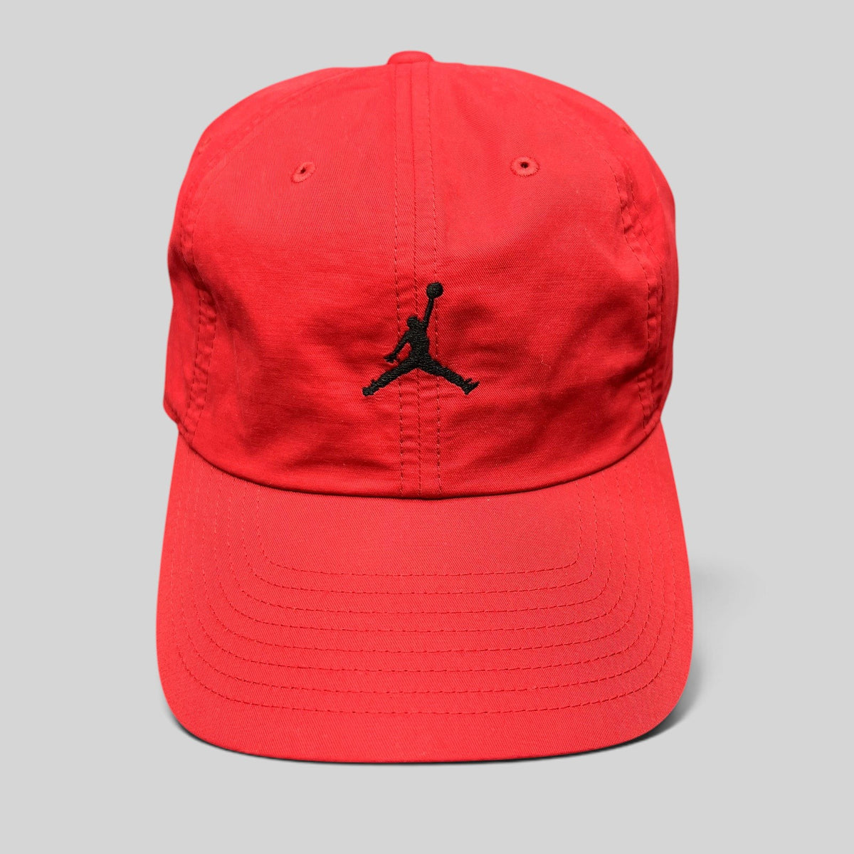Raree Finds red Nike Air Jordan strapback club cap with a black embroidered Jumpman logo and curved brim
