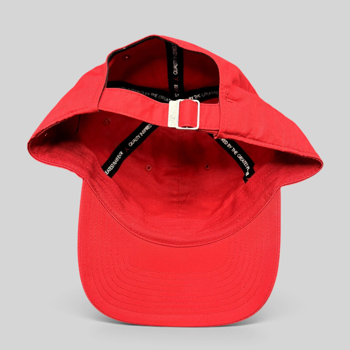 Raree Finds Nike Air Jordan red strapback club cap showing the interior adjustable metal buckle and branded taping.