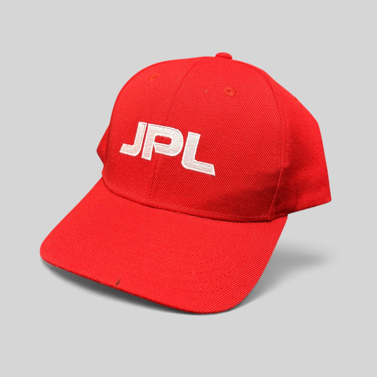 Raree Finds red JPL NASA snapback hat with white embroidered lettering on a structured crown