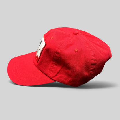 Raree Finds bright red cotton strapback hat with a woven Quest Kodiak aircraft patch and adjustable brass buckle