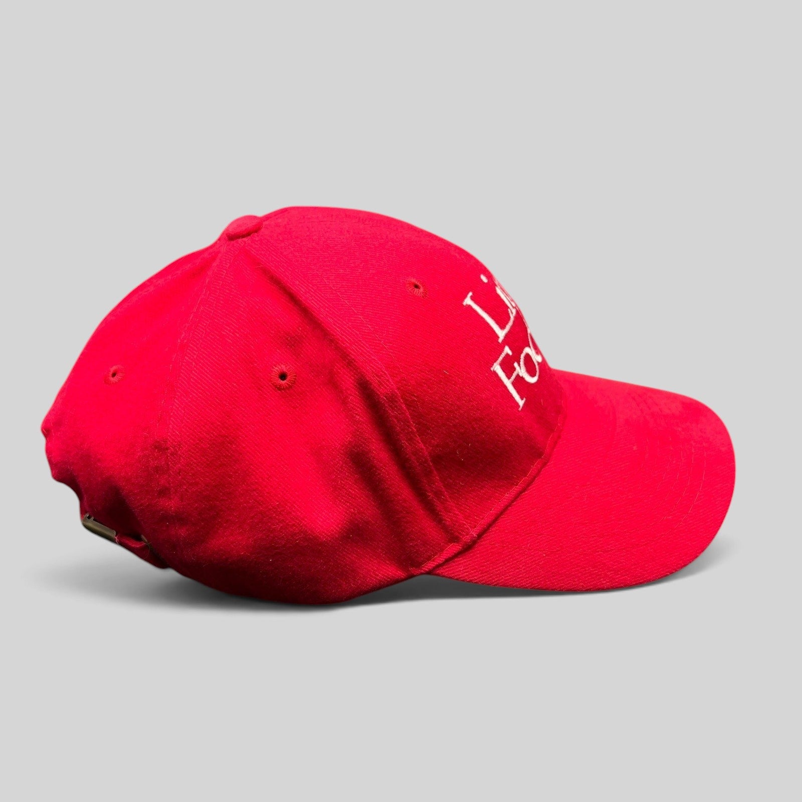 Raree Finds red Little Fockers promotional dad hat with white embroidered text and adjustable brass strapback closure