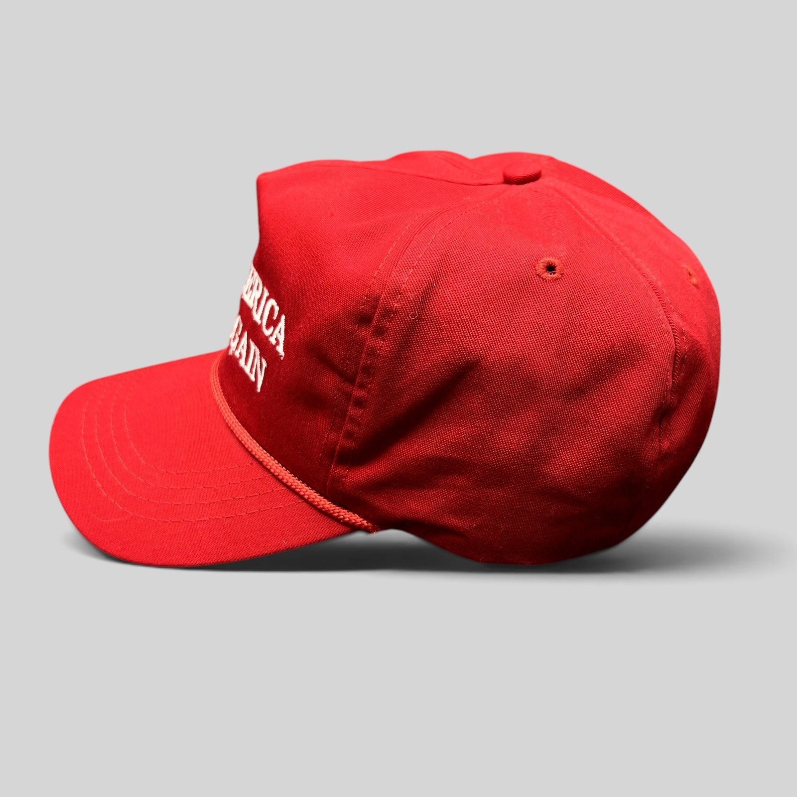 Raree Finds official red MAGA snapback hat with white embroidered lettering and braided rope detail