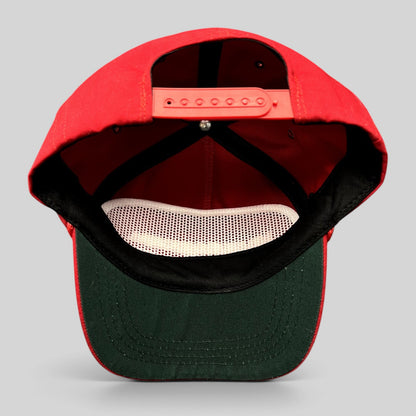 Raree Finds official red MAGA snapback hat with green undervisor and adjustable strap, interior view