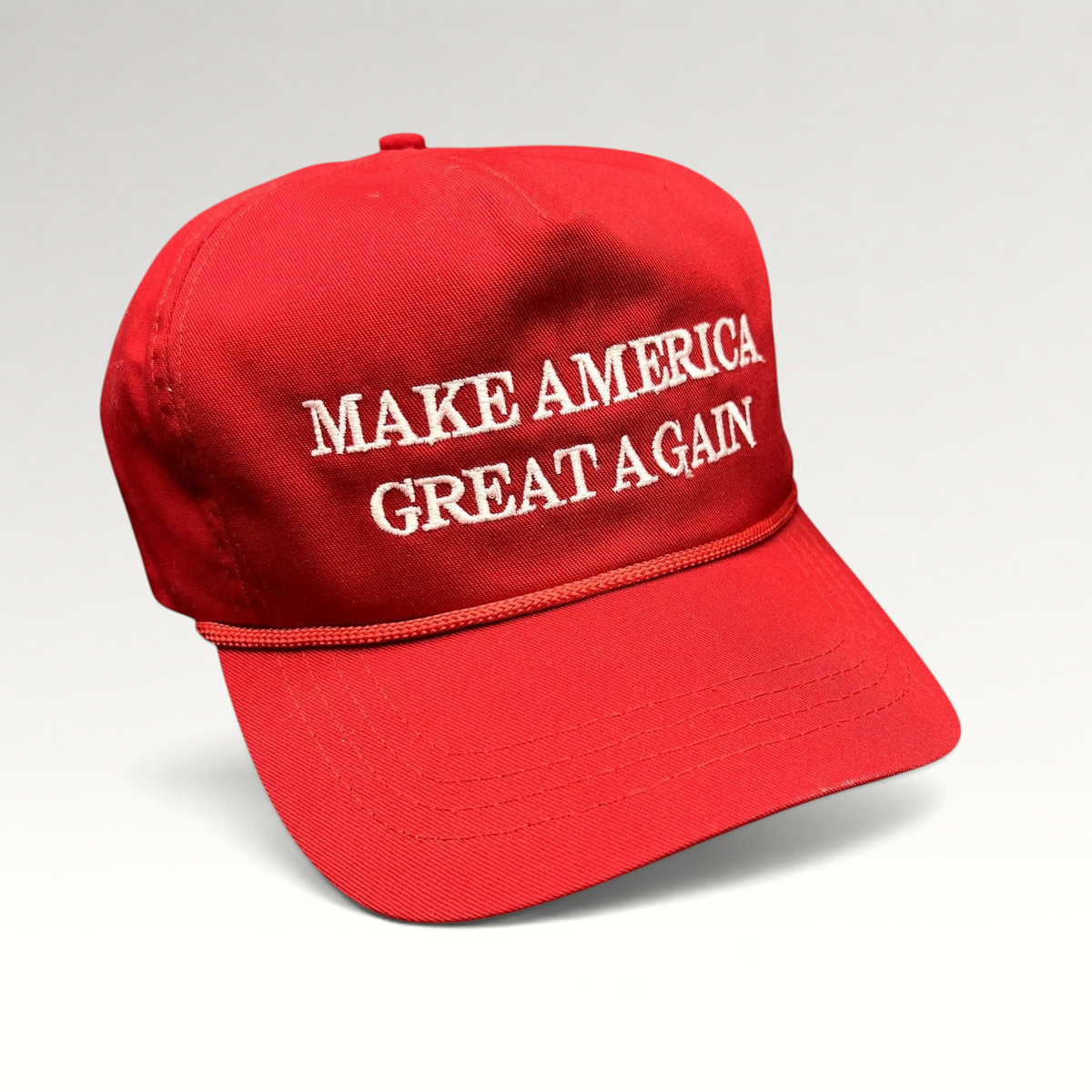Raree Finds official red MAGA snapback hat with white embroidered lettering and braided rope detail