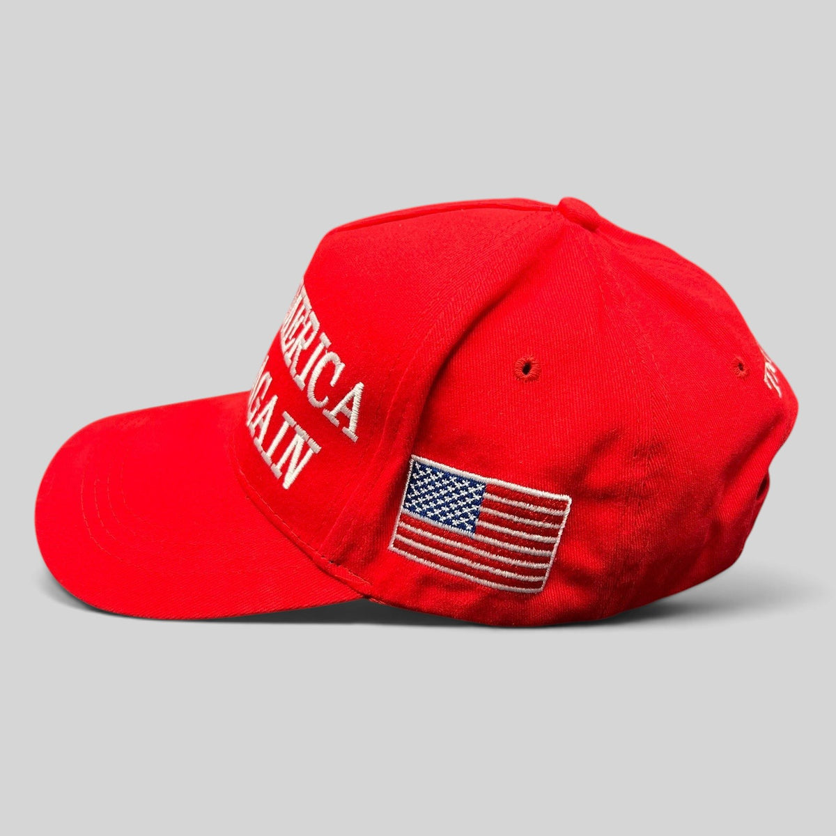 Raree Finds red Make America Great Again strapback hat with white embroidered text and American flag side patch