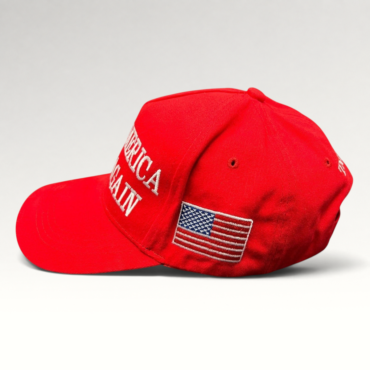 Raree Finds red Make America Great Again strapback hat with white embroidered text and American flag side patch