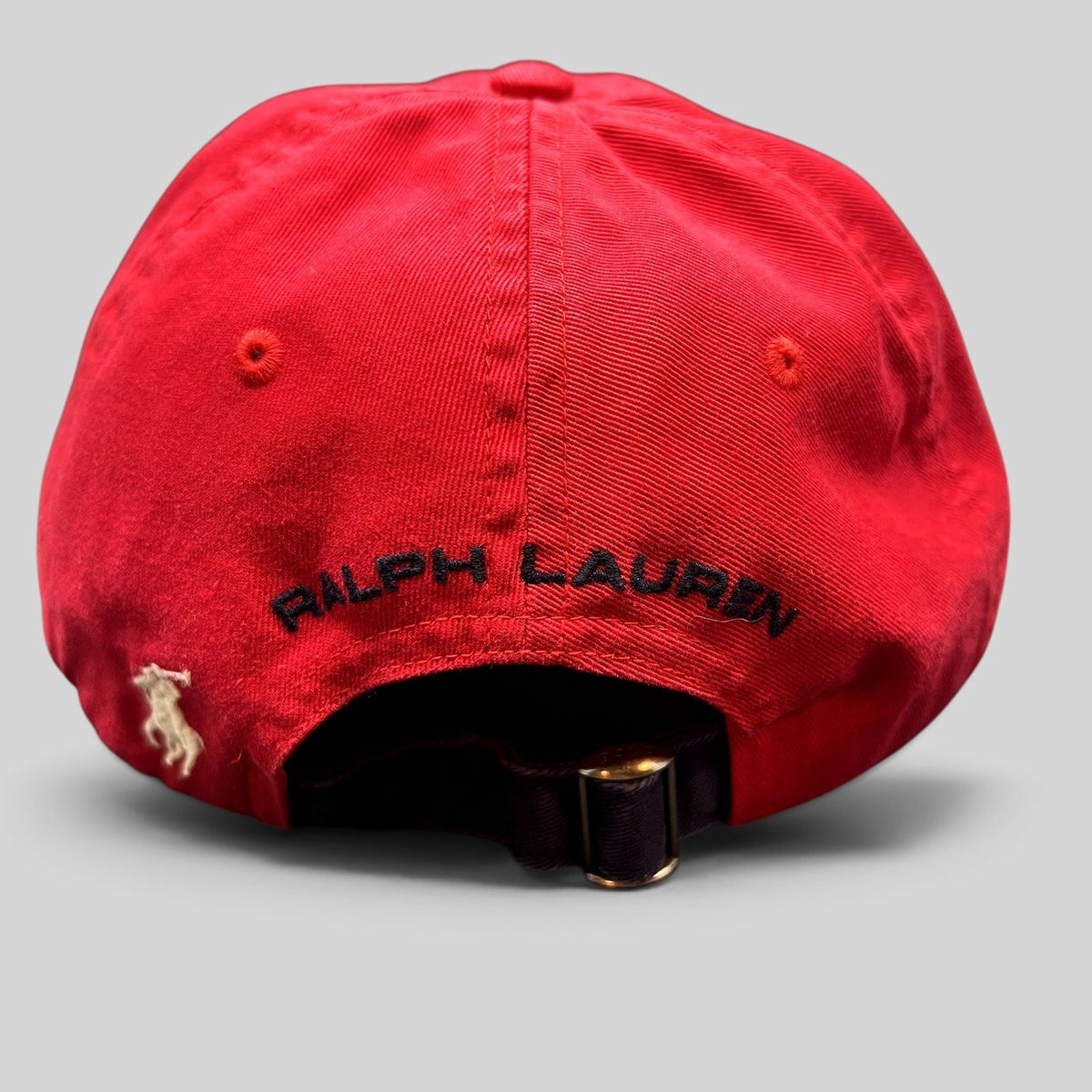 Raree Finds red Polo Sport Ralph Lauren cotton strapback cap featuring rear embroidered pony logo and arch lettering.