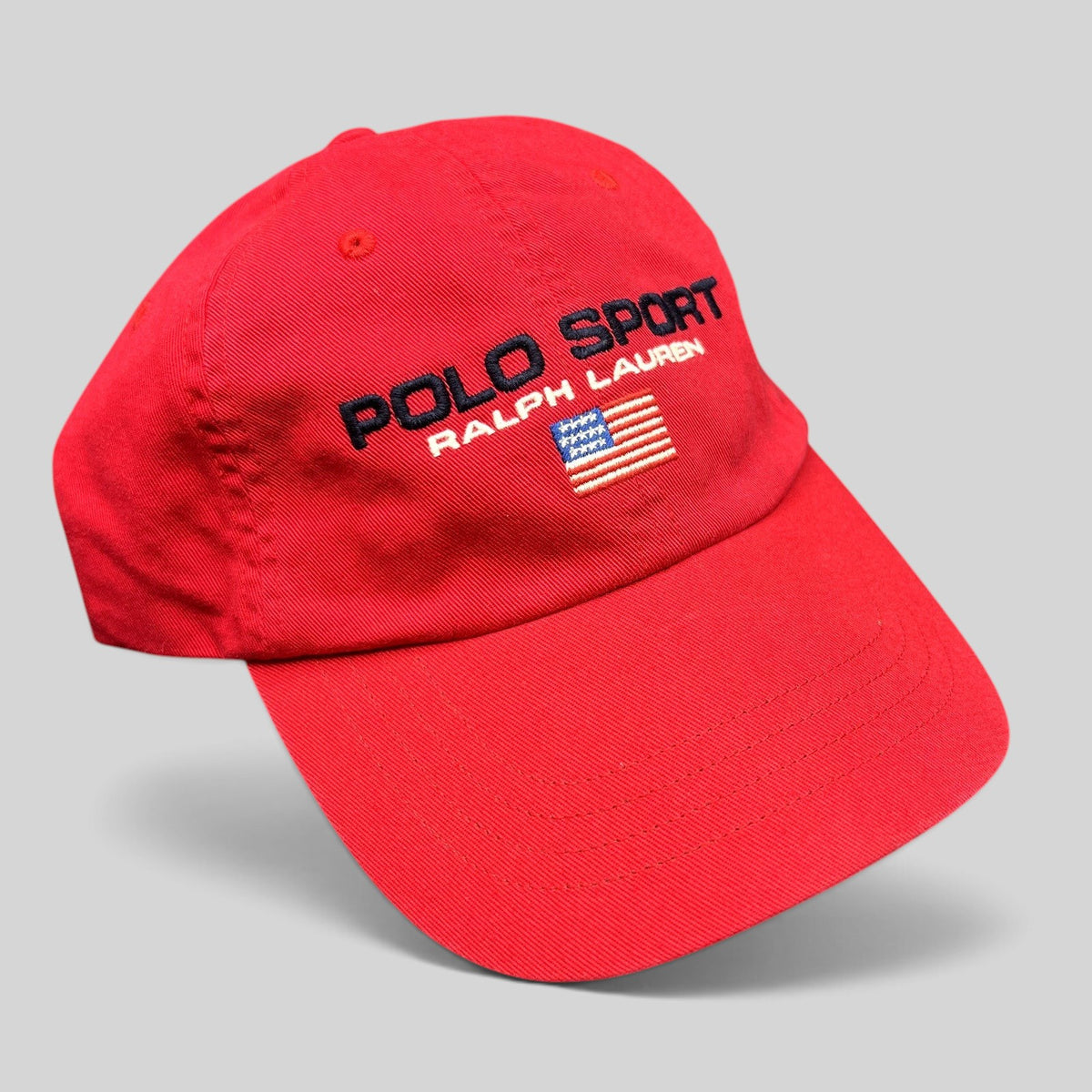Raree Finds red cotton Polo Sport Ralph Lauren strapback hat with embroidered USA flag and front spellout logo.
