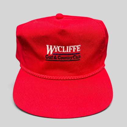 Raree Finds vintage red snapback hat with Wycliffe Golf & Country Club embroidery and decorative rope trim.