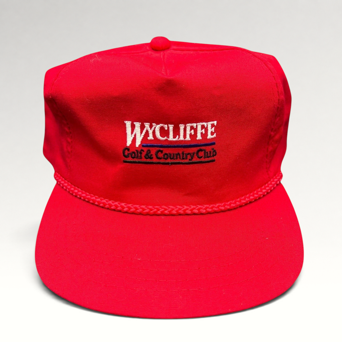 Raree Finds vintage red snapback hat with Wycliffe Golf & Country Club embroidery and decorative rope trim.