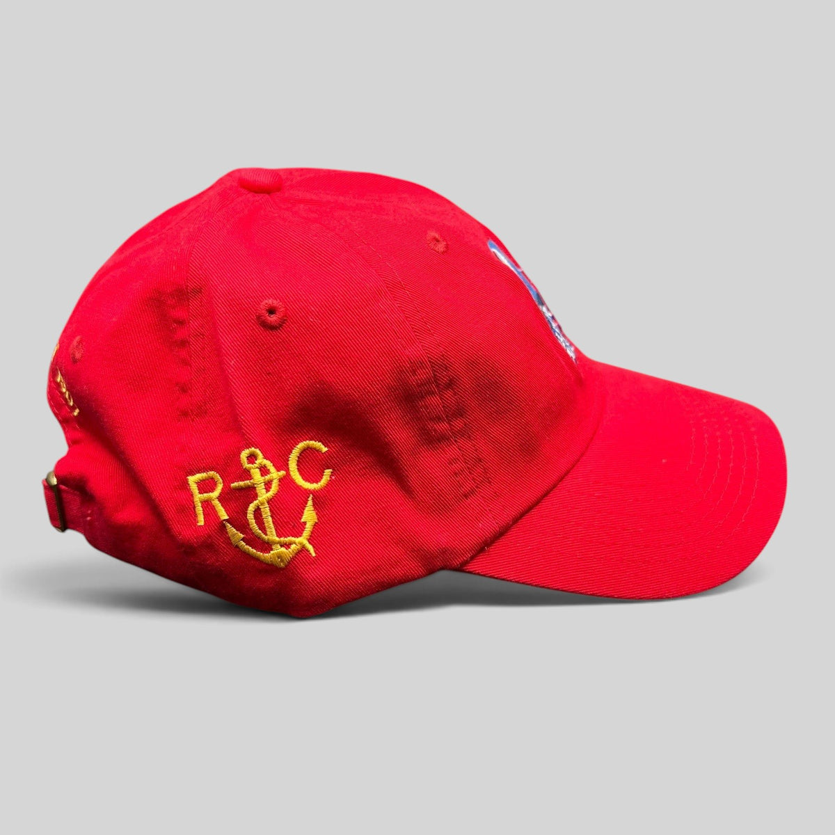 Raree Finds red cotton strapback hat featuring yellow anchor embroidery from the 2019 Los Angeles Yacht Club Harbor Cup