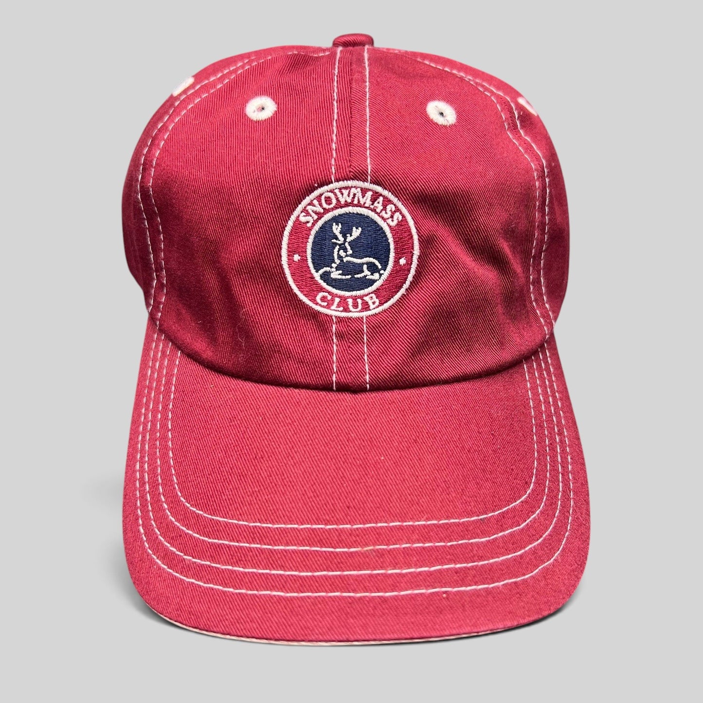 Raree Finds red Snowmass Club strapback hat with white contrast stitching and embroidered deer crest logo