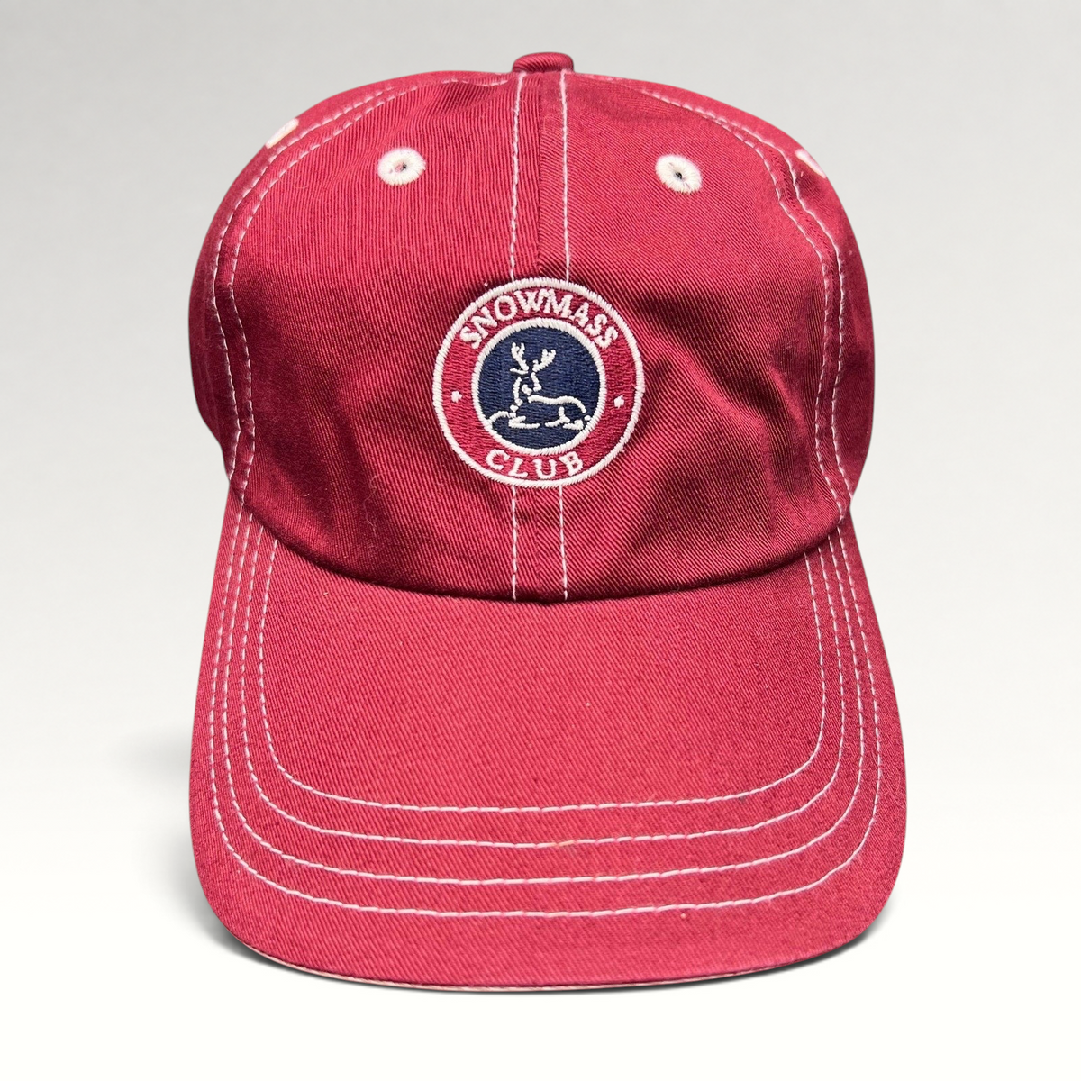 Raree Finds red Snowmass Club strapback hat with white contrast stitching and embroidered deer crest logo