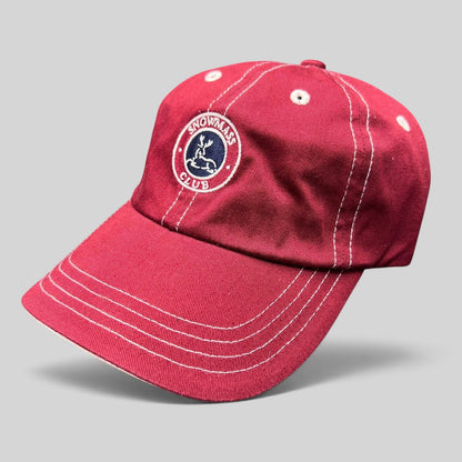 Raree Finds red Imperial strapback hat featuring the embroidered Snowmass Club deer crest and white contrast stitching.