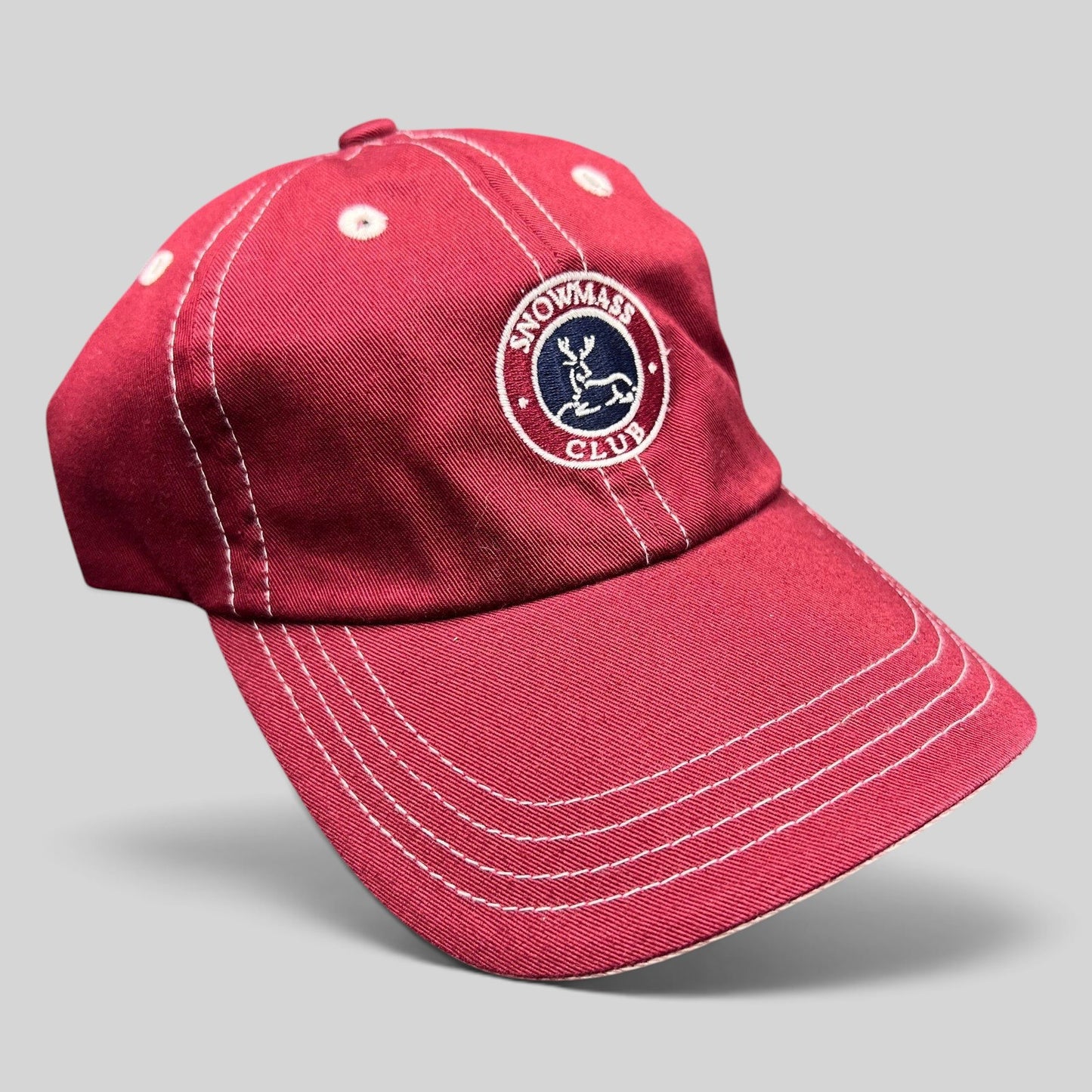 Raree Finds red Imperial strapback hat with white contrast stitching and Snowmass Club deer crest embroidery