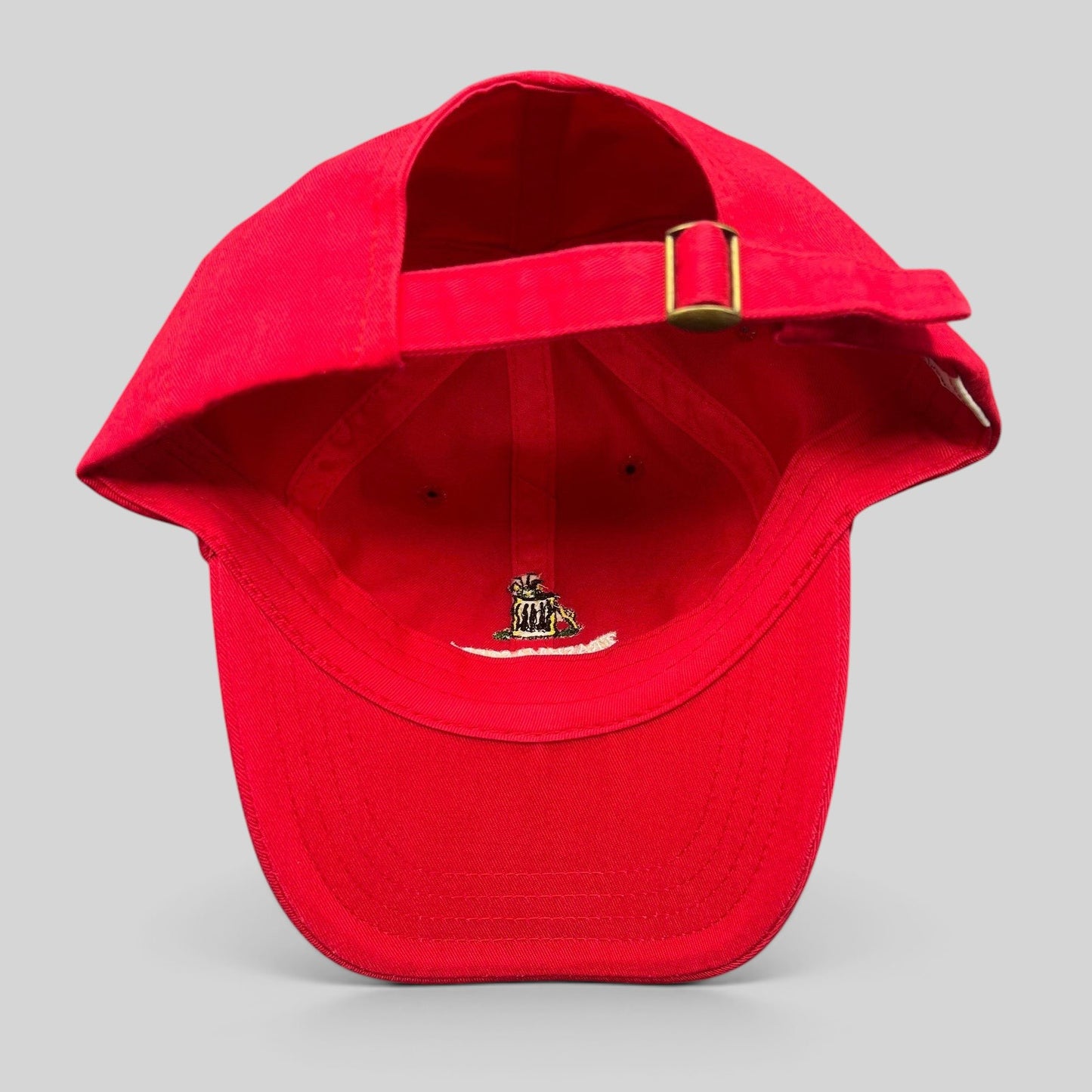 Raree Finds vintage red cotton strapback dad cap with brass buckle and interior embroidered trash can mascot logo