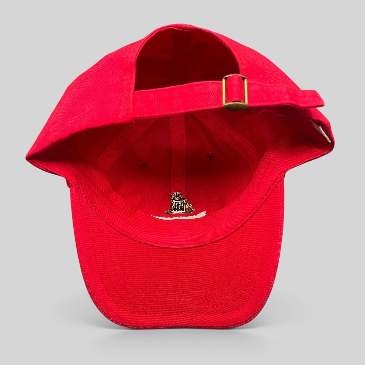 Raree Finds vintage red cotton strapback dad cap with brass buckle and interior embroidered trash can mascot logo