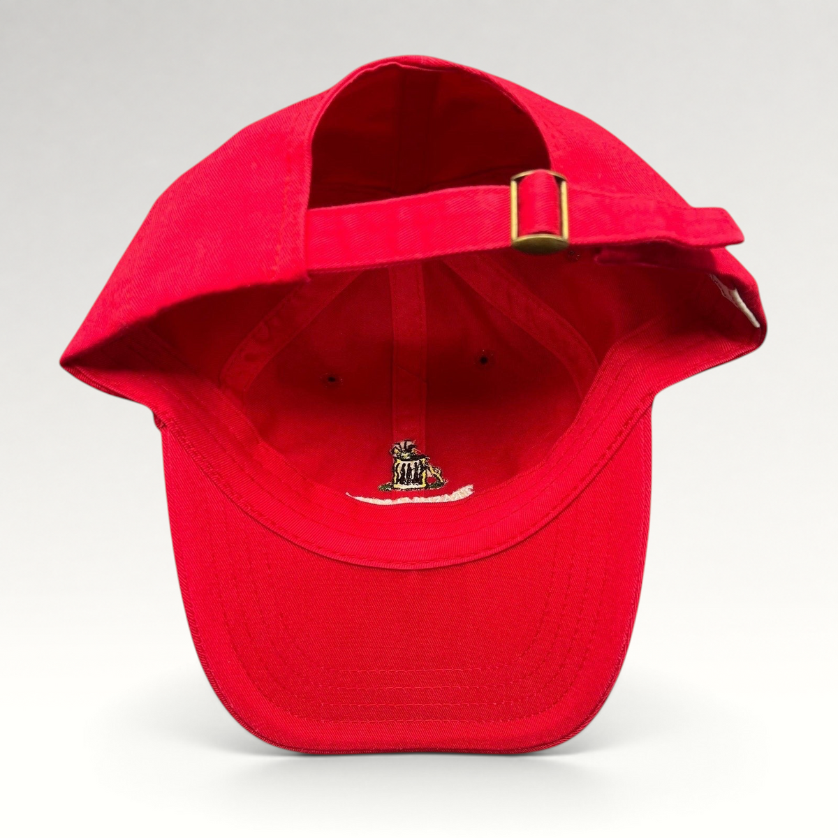 Raree Finds vintage red cotton strapback dad cap with brass buckle and interior embroidered trash can mascot logo