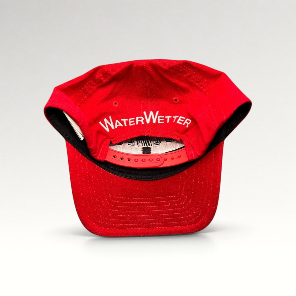 Raree Finds vintage red snapback hat with white WaterWetter embroidery on the back and adjustable plastic closure.