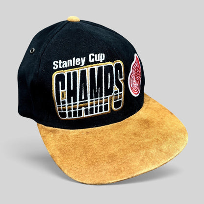 Raree Finds vintage 1997 Detroit Red Wings Stanley Cup Champs Starter strapback hat with black crown and tan suede brim.