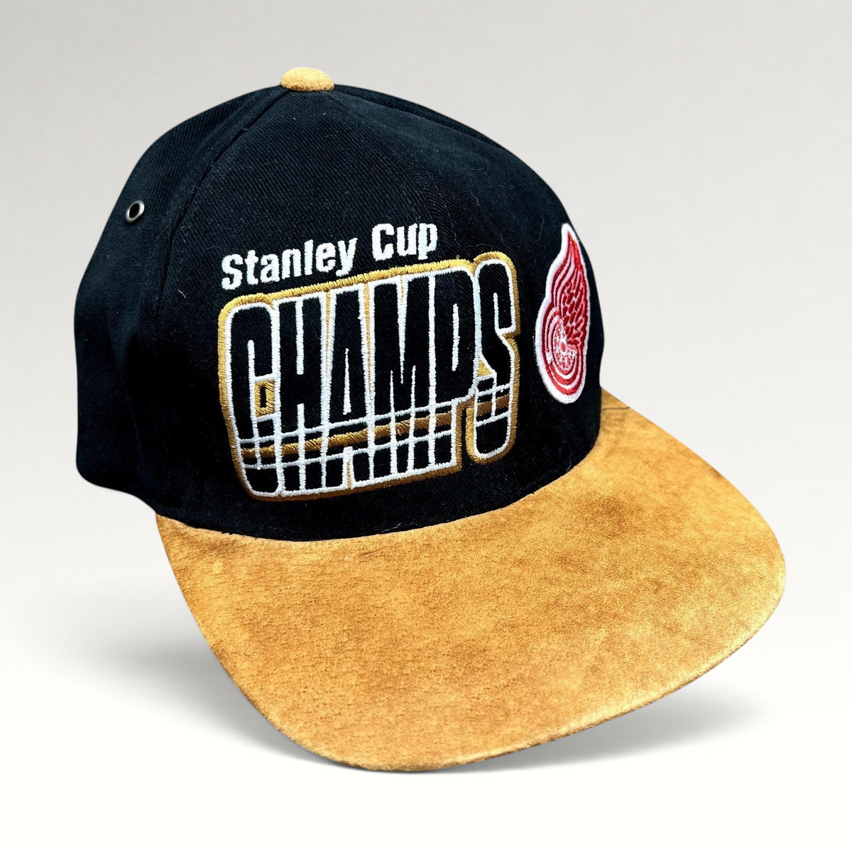 Raree Finds vintage 1997 Detroit Red Wings Stanley Cup Champs Starter strapback hat with black crown and tan suede brim.