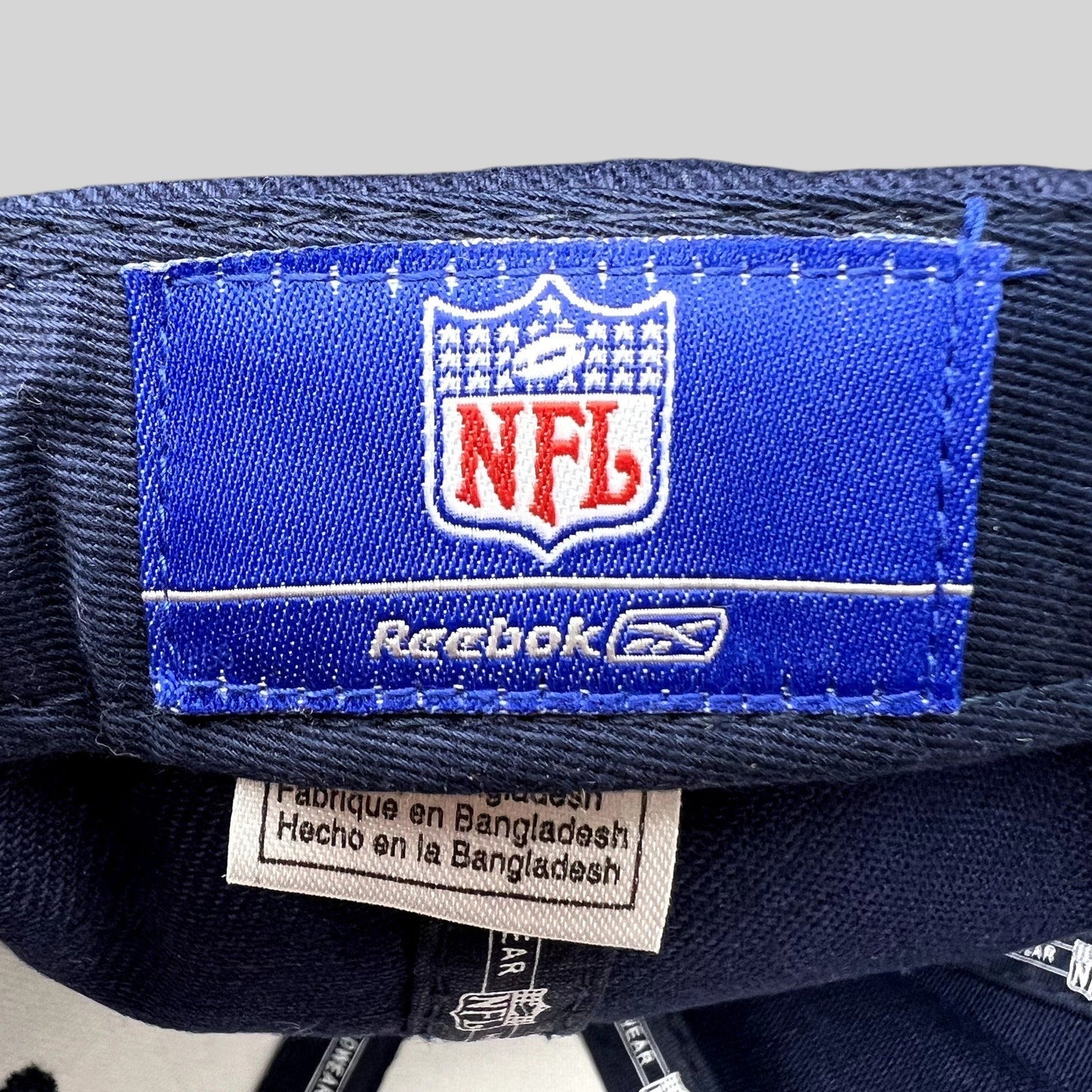 Raree Finds Reebok NFL Denver Broncos hat interior label with blue branding and Bangladesh origin tag