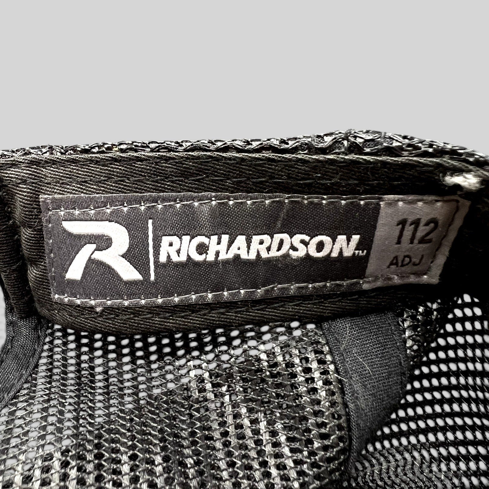 Raree Finds Richardson 112 trucker hat interior label with black mesh backing and adjustable snapback construction.
