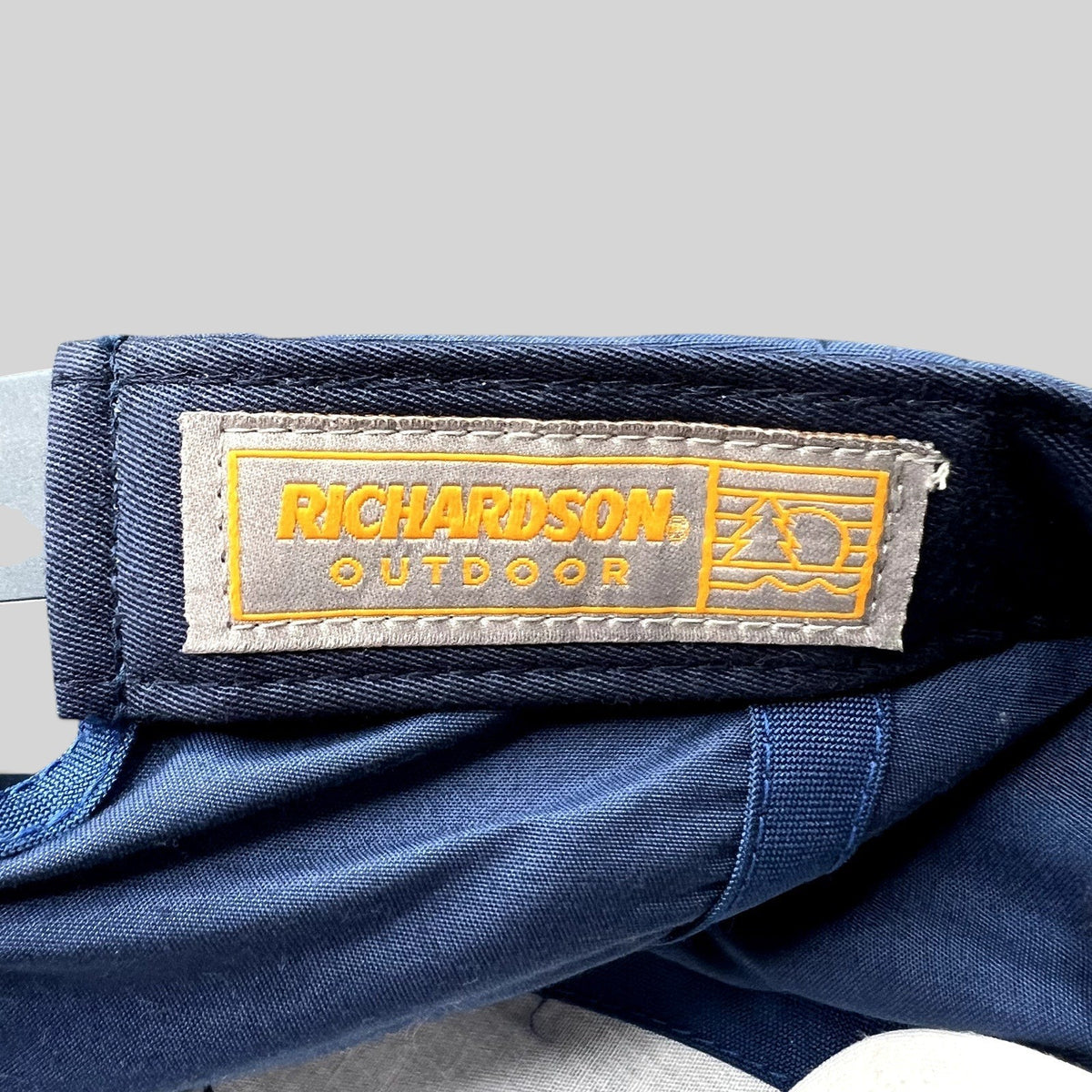 Raree Finds navy blue Richardson Outdoor cap interior label with yellow mountain logo branding