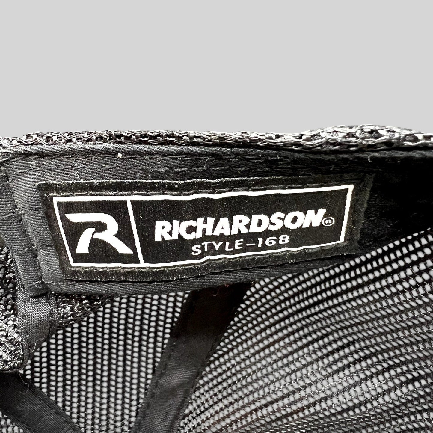 Raree Finds Richardson style 168 interior label on a black mesh trucker hat