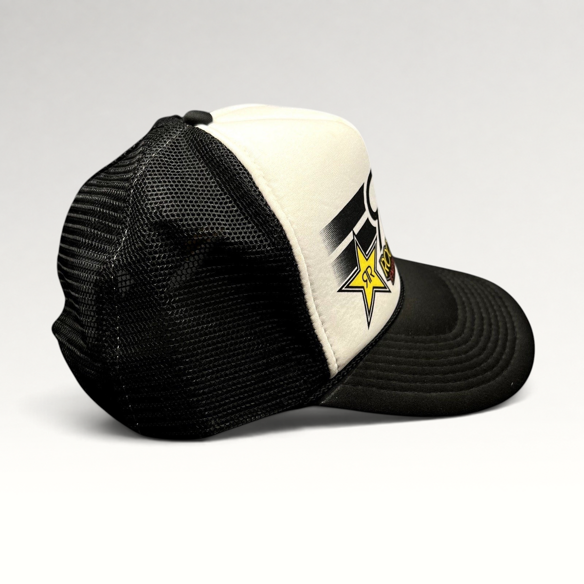 Raree Finds vintage Y2K Rockstar Energy Drink trucker hat with black mesh back, white foam front, and logo detail.