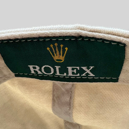 Raree Finds vintage Rolex promotional hat interior label with iconic gold crown logo on green fabric