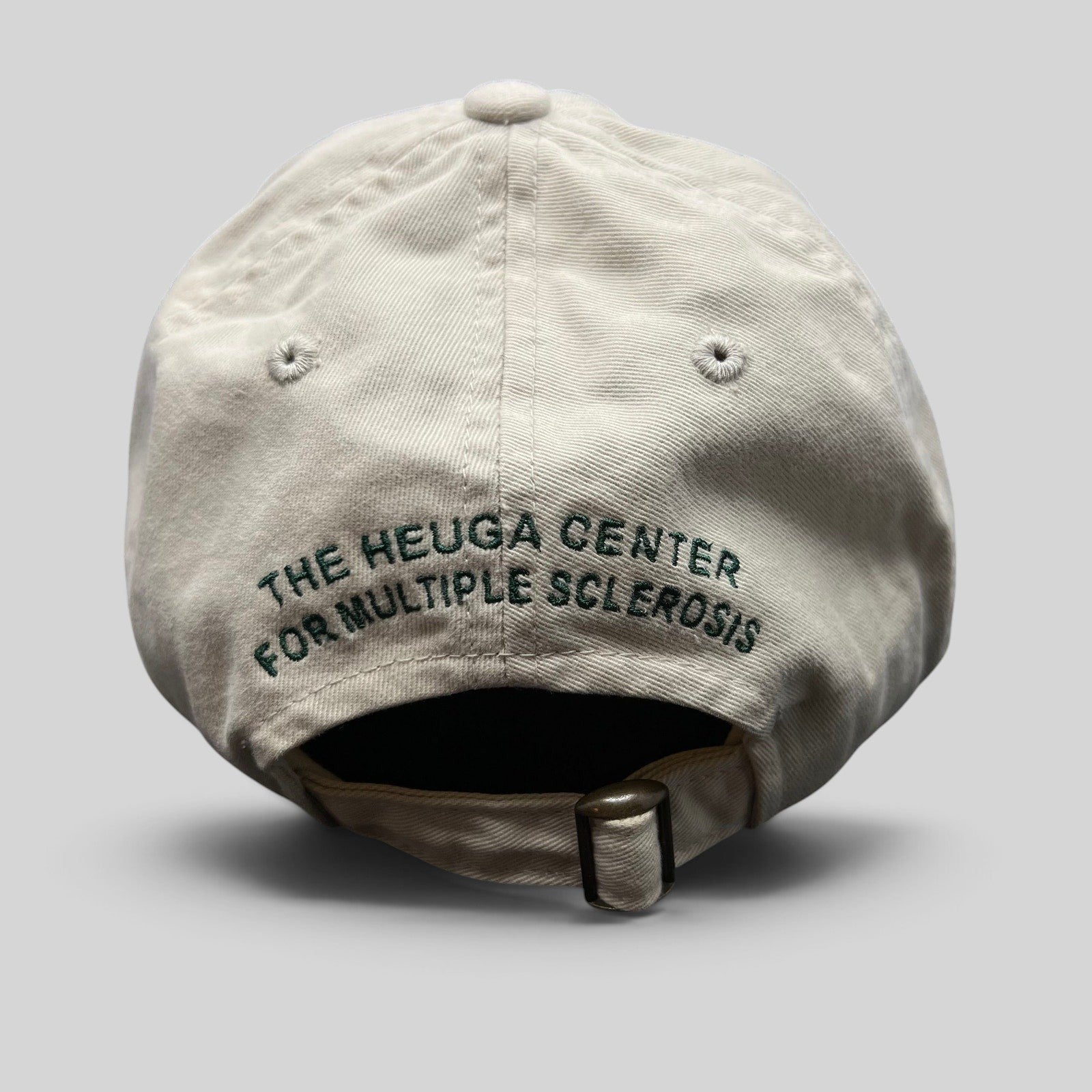 Raree Finds vintage Rolex khaki cotton strapback hat with The Heuga Center embroidery on the back and metal buckle