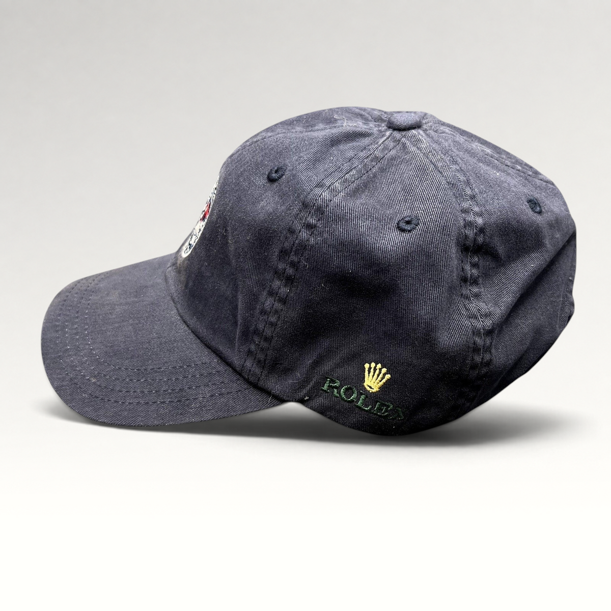 Raree Finds navy blue 2012 Rolex Newport Bermuda Race Week sailing cap with embroidered logo and green undervisor
