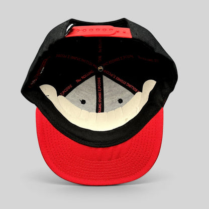 Raree Finds The Rolling Stones Zip Code 2015 tour snapback hat with black crown, red brim, and branded interior tape.