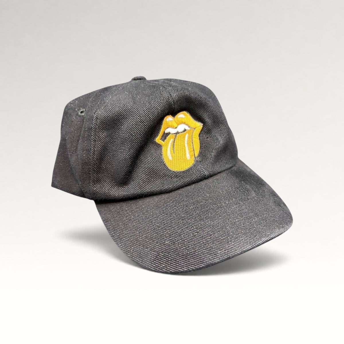 Raree Finds vintage 1997 Rolling Stones Bridges to Babylon black cotton snapback hat with gold tongue logo embroidery