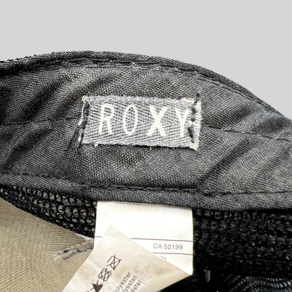 Raree Finds Roxy trucker hat interior label showing brand logo and care tag details on black mesh fabric