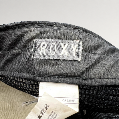 Raree Finds Roxy trucker hat interior label showing brand logo and care tag details on black mesh fabric
