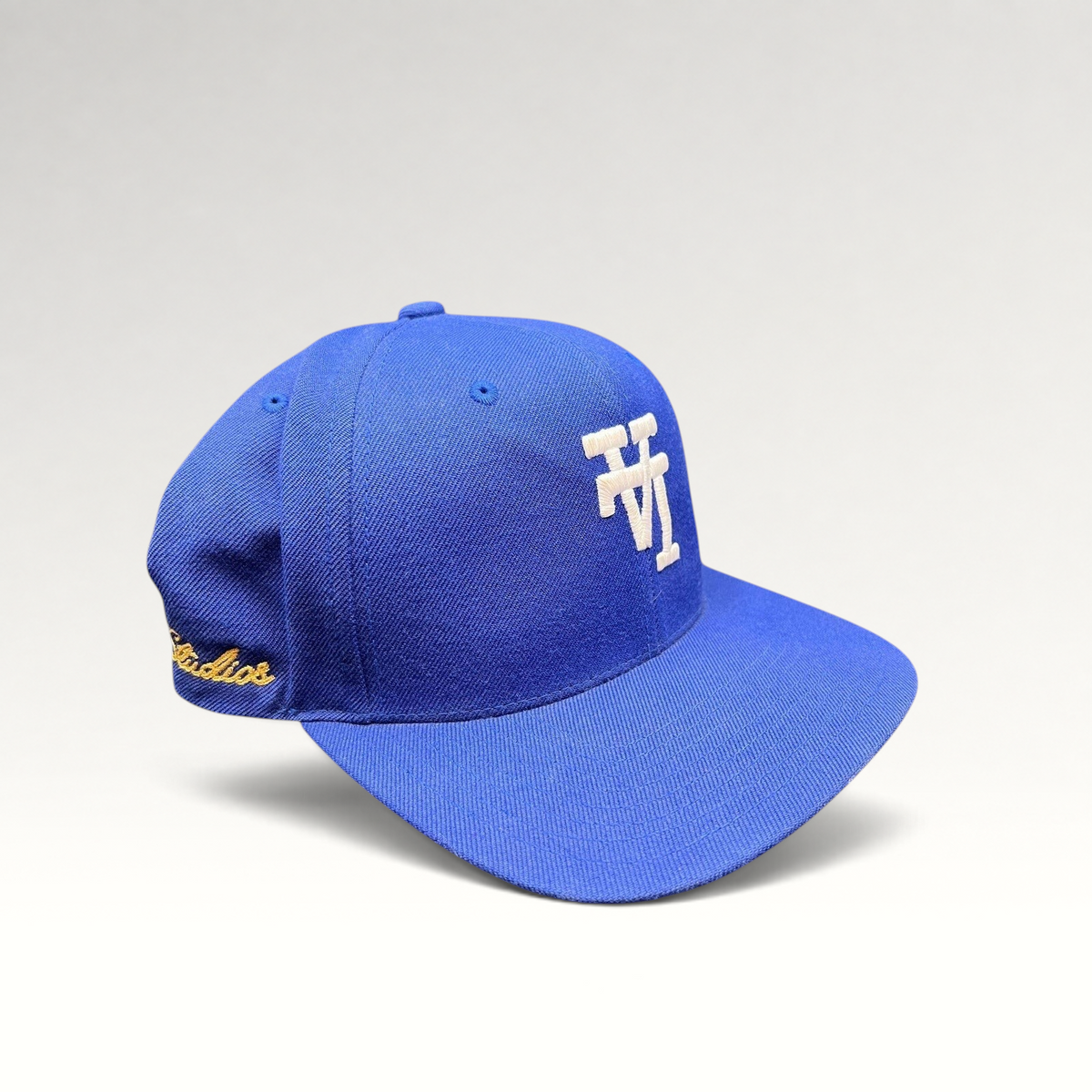 Raree Finds royal blue Uniform Studios snapback hat with white embroidered logo and side detailing