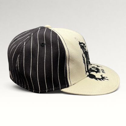 Raree Finds RVCA Y2K black and white pinstripe snapback hat with a bold crest graphic on the front panel