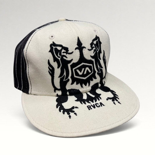 Raree Finds vintage RVCA snapback hat in black and white with a bold crest graphic and flat bill design.