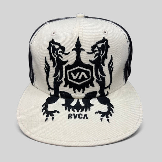 Raree Finds vintage RVCA black and white wool blend snapback hat featuring a symmetrical crest graphic on the crown.