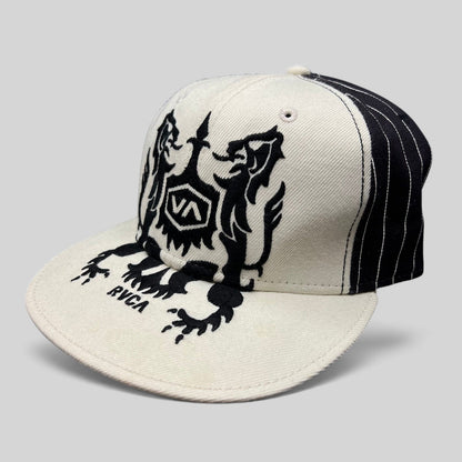Raree Finds RVCA Y2K black and white wool blend snapback hat with a bold crest graphic on the crown and flat bill