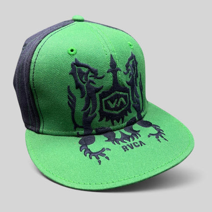 Raree Finds vintage green and black RVCA snapback hat featuring a gothic lion crest logo and flat brim