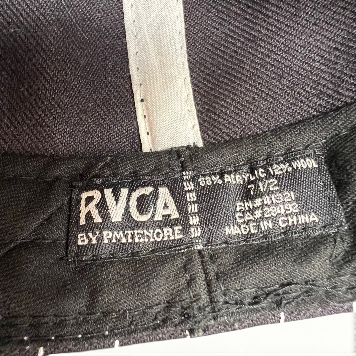 Raree Finds RVCA by PM Tenore hat interior label showing size 7 1/2 and wool blend material composition