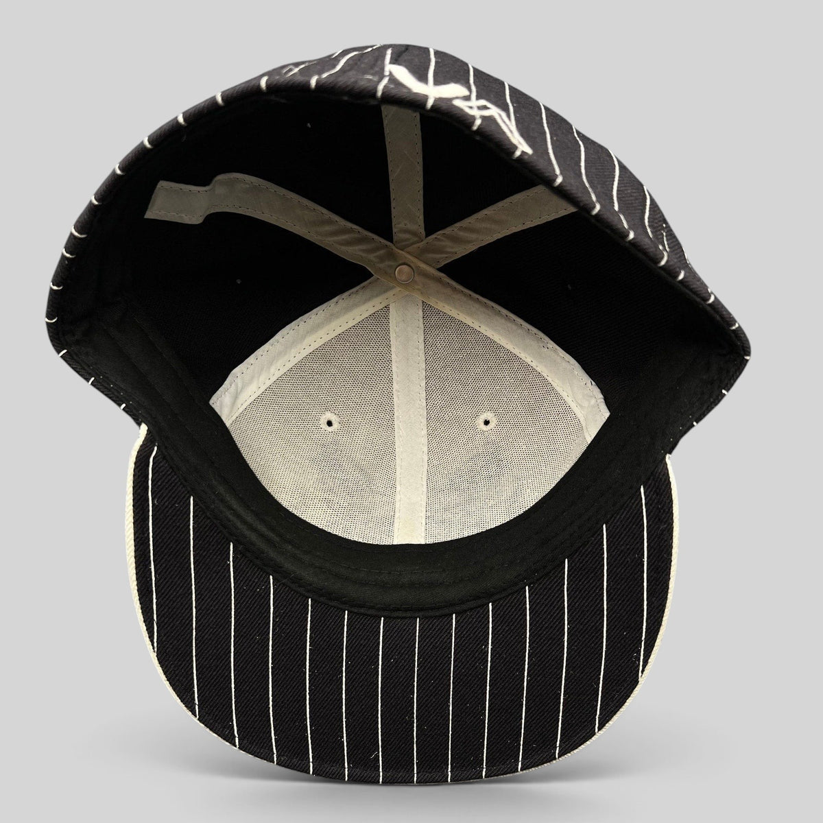 Raree Finds vintage RVCA black and white pinstripe fitted hat with interior view showing structured wool blend crown