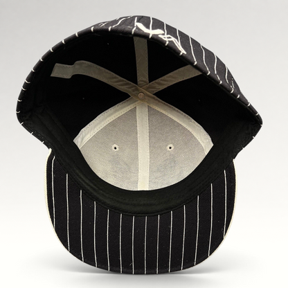 Raree Finds vintage RVCA black and white pinstripe fitted hat with interior view showing structured wool blend crown